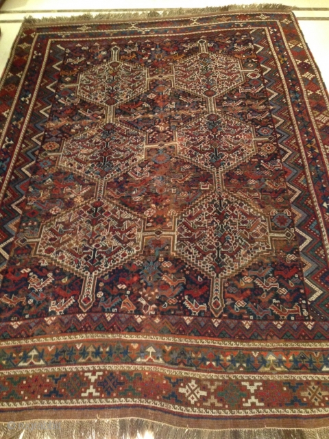 rug no	:	28
size	:	276 x 202
type	:	Antique 1900
origin	:	Iran
design	:	Khamseh Morghi
content	:	Wool on wool



this main carpet is original morghi(chicken) in very good even low pile-no knots showing. it has pretty original kilim and fringes- it can be used  ...