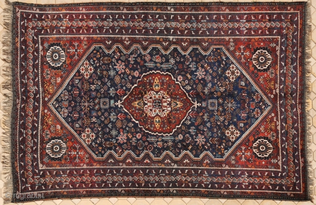 RUG NO : 14 
 
SIZE : 315 x 225 
 
TYPE : Antique 1910 
 
ORIGIN : Iran 
 
DESIGN : Qashqai Darreh Shuri 
 
CONTENT : Wool on wool
 
BACKGROUND  ...