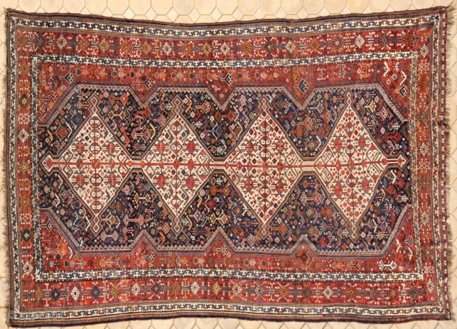 RUG NO : 15 
 
SIZE : 395 x 203 
 
TYPE : Antique 1880 
 
ORIGIN : Iran 
 
DESIGN : Arab Khamseh 
 
CONTENT : Wool on wool 
 
BACKGROUND  ...