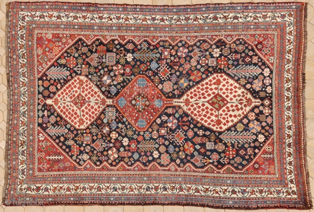 RUG NO : 18 
 
SIZE : 292 x 209 
 
TYPE : Antique 1900 
 
ORIGIN : Iran 
 
DESIGN : Qashqai Kashkuli 
 
CONTENT : Wool on wool 
 
BACKGROUND  ...