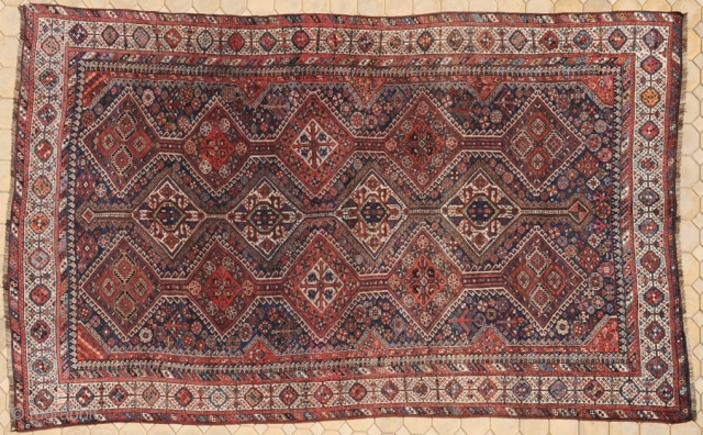 RUG NO	:	42
SIZE	:	462 x 256
TYPE	:	Antique 1890
ORIGIN	:	Iran
DESIGN	:	Arab Khamseh
CONTENT	:	Wool on wool
BACKGROUND COLOUR	:	Multi
BORDER COLOUR	:	Multi.

this is the  largest  nomadic  rug in  my  collection .it must have  been  weaved in a  ...