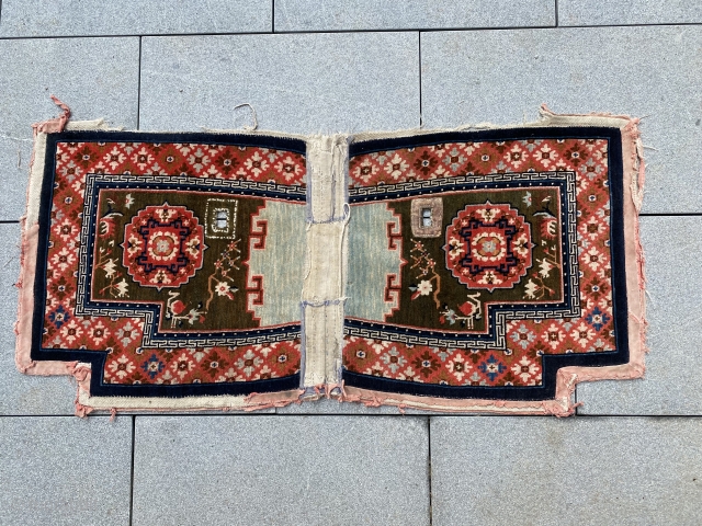 Tibetan saddle rug circa 1900. Great condition with original out edges and middle section as found in Lhasa in 1987. 
Beautiful blue middle field. Measurements ca. 129 x 62 cm including edge. 