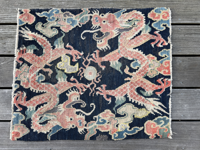 Getting ready for the year of the dragon….two charming Tibetan dragons playing with the wishfulfilling pearl.
Fine piece with great drawing. Condition as found with small repiled areas and some damage to the  ...