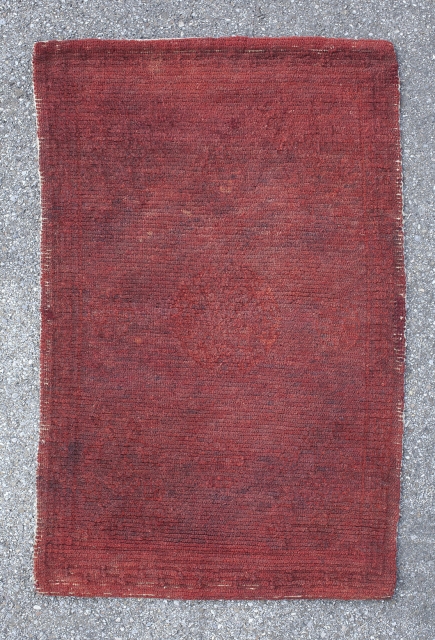 Lovely Tibetan sitting rug or saddle top. Warm red tone. Very subtle medallion pattern. Great condition. 1st quarter 20th century. 83*54 cm.           