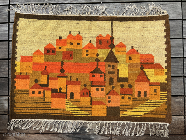 Polish artist rug from the 1970s. Wool on This vintage Polish folklore kilim wall hanging beautifully captures a traditional village scene with bold color blocks and stylized forms. In warm tones of  ...