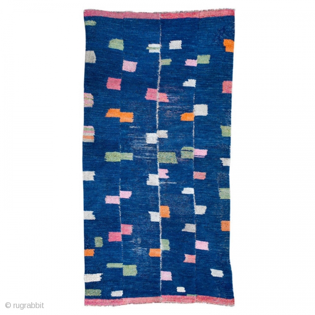 This antique Tibetan Tsutruk rug exhibits the playfulness and creativity of Tibetan nomads.

Constructed in four strips woven on a narrow backstrap loom and joined together, this rug has a unique design of  ...