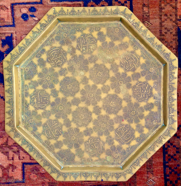 This original antique Persian/Middle Eastern Octagonal 19th c. brass tray features exquisite hand engravings with eight Arabic calligraphy cartouches.
The intricate design and the beauty of the engravings make it a unique piece  ...