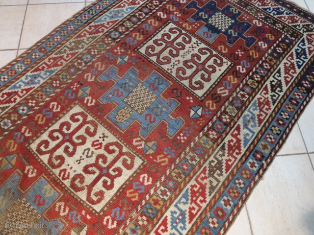 Caucasian Kazak Karachof,  in some part of the field but shining. cm 235x129. Good rug to restore or to collect with a cheap price.        