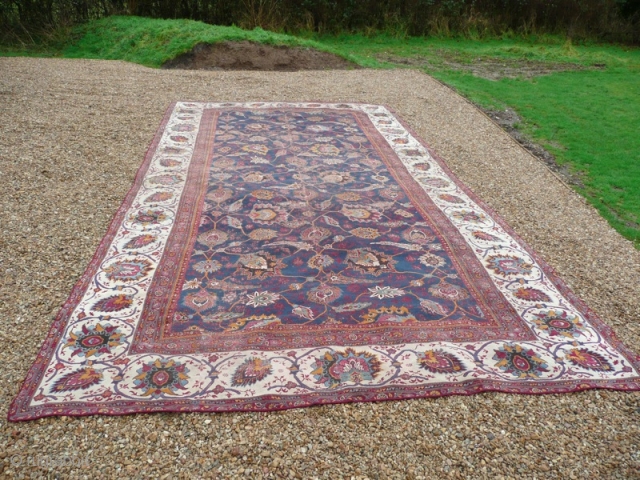 Late 19th century Indian large carpet.

Beautiful Indian Amritsar type carpet. This lovely old piece has lived a life; there are various old patches and repairs, also it has been reduced in size  ...
