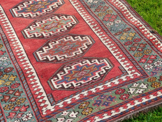 Attractive Moghan long rug, with lovely green border, size 10' x 3'.10".  Good overall condition, has been cleaned and fringes replaced.           