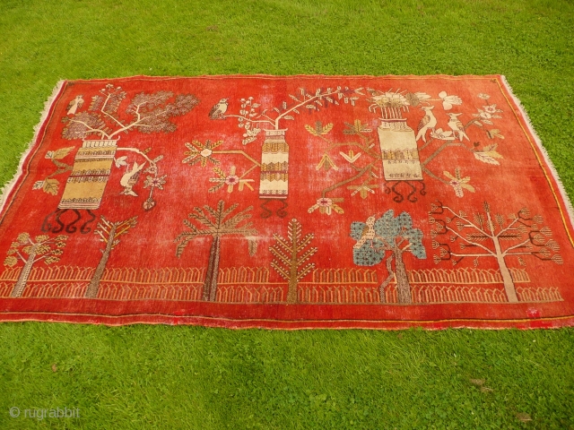 Charming 1930's Khotan 'landscape' rug decorated with trees, vases and birds - convincing enough to make a cat curious (see image 5). Condition, some areas of wear and old moth damage but  ...