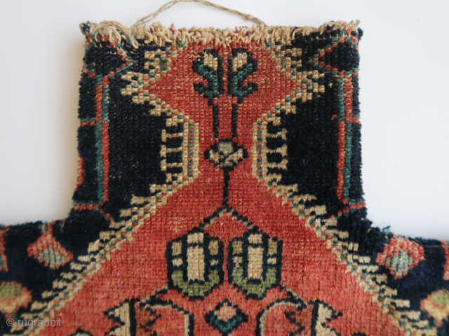 One large redwood brick colored rhombic, divided ( in two triangles ) at the bottom of the bag,  two birds on each side,a dark blue ground . With some green floral  ...