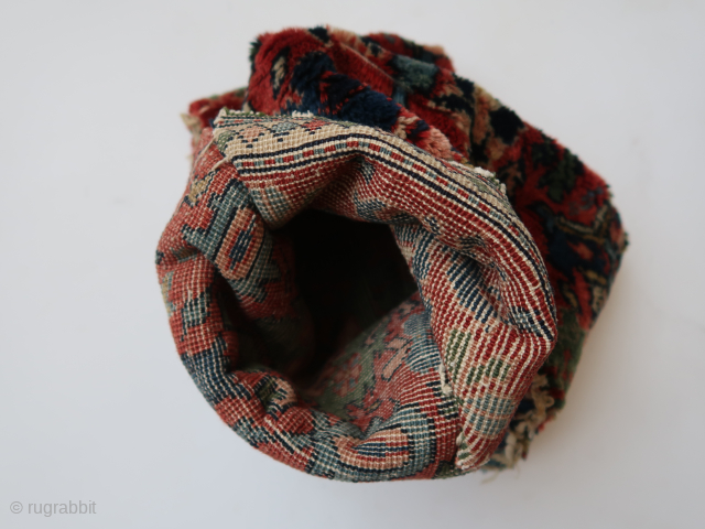 Folded / doubled fragmented bag.  Folded  ca : 26 cm x 20 cm .Floral motives ,different colors .   Persian ?         