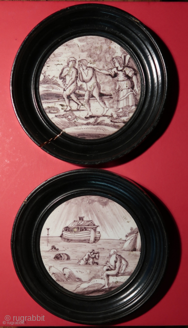 Rotterdam, 18th.century.  Two original mangan glazed Dutch tiles.   Depicting the Flood and the Exile from Eden.   Diameter including the outer wooden frame,  ca. 16 cm.   ...