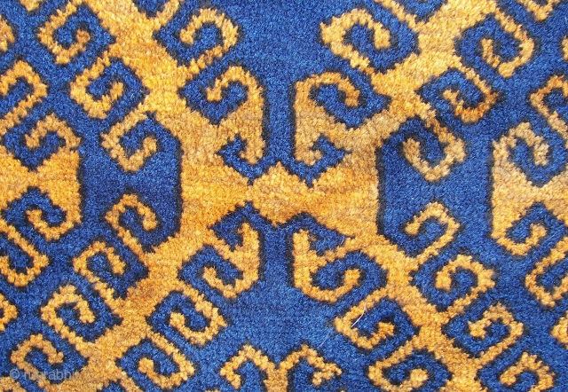 Mahswani ,old ,ca, 180 cm. x ca. 100 cm.   Wool on wool and some goathair.   A rich blue on a golden brown ( abrash ) honey field. Top  ...