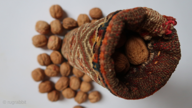 Seasons greetings with nuts. Ca ; 26 cm. x 9 cm. Wool on wool, cotton, wood, bamboo ( inside.) South west Persian tribal ?   old/antique.  95,oo euro ex transportcosts.  ...