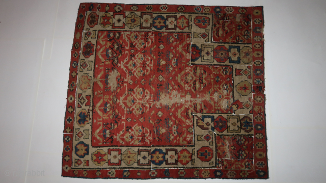 Several fragmented fragments from an old north west Persian rug , needing some tlc . ca. 100 cm x 100 cm. 90. euro ex transport costs.       