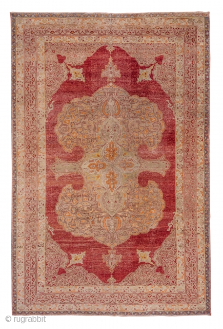 Oushak Carpet

9.0 x 13.5
2.74 x 4.11

The rather worn madder red open field is nearly covered by an oversize double spadiform  ivory medallion with internal red arabesque outlining which is repeated in  ...