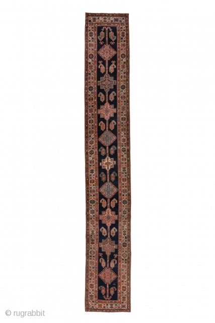 Northwest Persian Runner

2.9 x 18.3
0.88 x 5.57

A long pole medallion ending in double hooks is composed of hooked lozenges and stepped octogrammes on the navy ground. Serrated botehs flank the central motif  ...