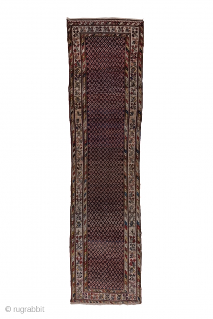 Malayer Runner

3.1 x 12.6
0.94 x 3.84

The  abrashed charcoal field features a close seme of tiny ovals within an ivory triple flower border in the Turkish manner and flanking diagonal colour-striped minors.  ...
