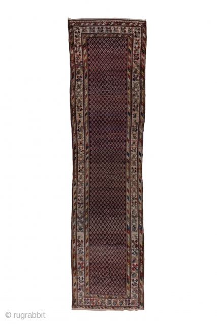 Malayer Runner

3.1 x 12.6
0.94 x 3.84

The  abrashed charcoal field features a close seme of tiny ovals within an ivory triple flower border in the Turkish manner and flanking diagonal colour-striped minors.  ...