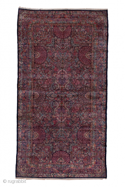 Kerman Carpet

8.10 x 17.0 
2.46 x 5.28
This top condition 1930's SE Persian urban carpet has a dark blue field covered with a fantgasy of palmettes radiating peacock  tails of floral sprays,  ...