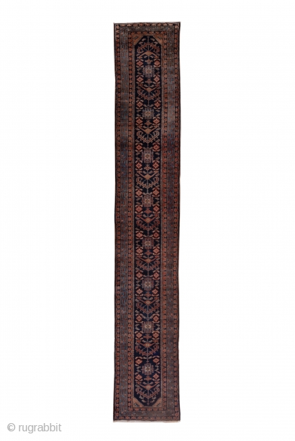 Hamadan Runner

3.0 by 18.0

Circa: 1920

More village Hamadan than Malayer, this repaired, but good pile runner has a predominantly dark palette  with a navy field centered by a chevron-branched pole medallion interrupted  ...