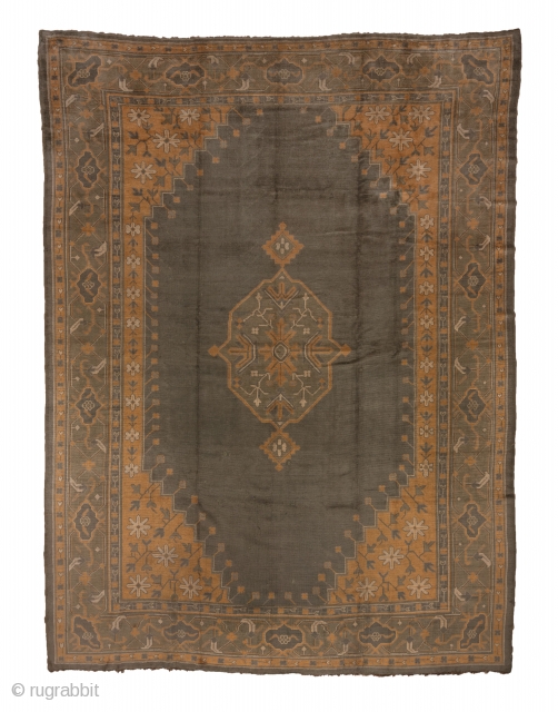 Oushak Carpet

11.6 x 15.1
3.53 x 4.60
 
This antique western Turkish workshop carpet, in quite good condition, displays a soft, pomegranate red sub-field with a green cartouche-shaped central medallion enclosing stiff  ivory  ...