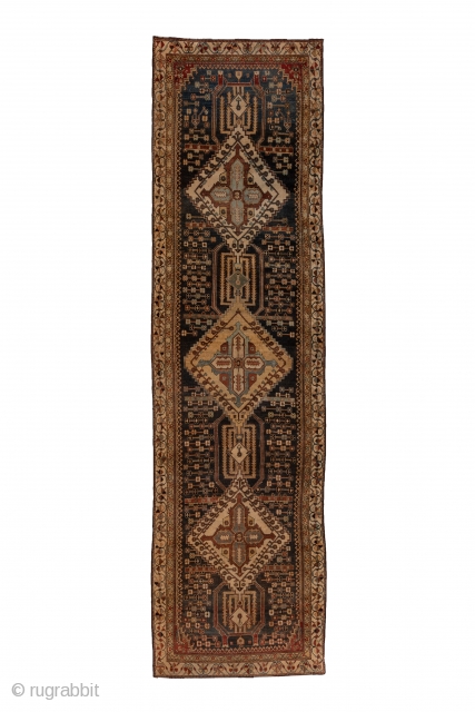 Baktiary Runner

3.9 x 13.8
1.18 x 4.20
 
This Chahar Mahal village kenare in lowish, but even condition, sports an abrashed dark blue ground centred on a pole medallion of three large, stepped, ivory  ...