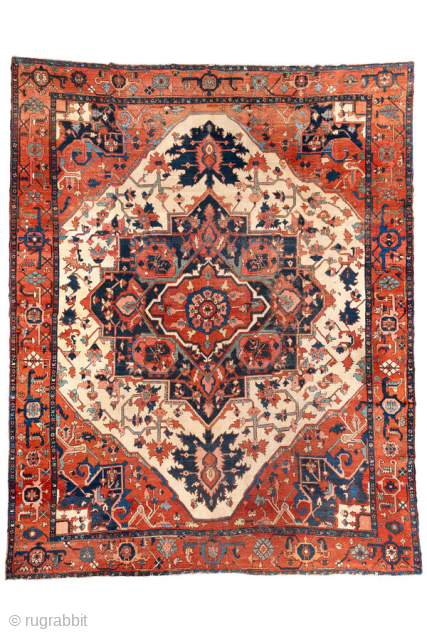Antique Persian Serapi Carpet, circa 1880. Featuring a grand geometric medallion on an ivory field with rich brick-red and deep indigo accents, framed by a bold tribal border. A classic Northwest Persian ...