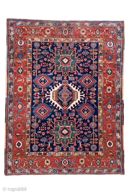 Antique Persian Karaje Rug, circa 1910. Featuring bold geometric medallions on a deep indigo field with red and ivory accents, framed by a classic angular border. Strong village character with crisp drawing ...