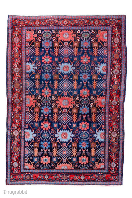 Antique Persian Senneh Rug, circa 1900. Featuring an intricate allover Herati design on a deep indigo field with soft coral and ivory accents, framed by a finely detailed border. Tightly woven with  ...