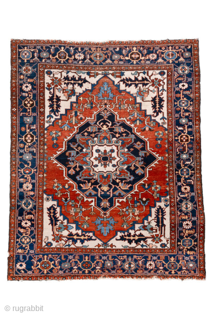 Antique Persian Serapi Rug, circa 1900. Featuring a bold geometric medallion on an ivory field with rich red and deep indigo accents, framed by a classic Heriz-style border. Strong Northwest Persian village  ...