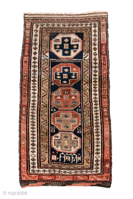 Antique Persian Kurdish Runner, circa 1910. Featuring stacked geometric medallions on a deep indigo field with soft coral and ivory accents, framed by simple tribal borders. Bold, graphic village weaving with strong ...