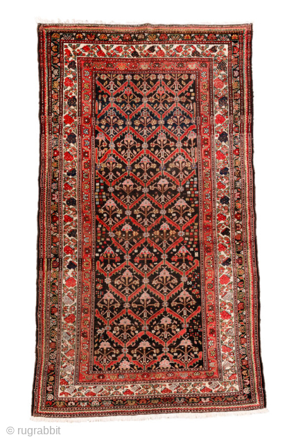 Antique Persian Malayer Rug, circa 1910. Featuring an allover lattice design on a dark ground with red and ivory accents, framed by multiple detailed borders. Finely drawn village weaving with elegant, rhythmic ...