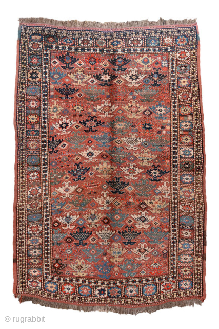 Antique Kurdish Rug, circa 1900. Featuring an allover tribal pattern on a warm rust field with soft blue and ivory accents, framed by a geometric star border. Lively village weaving with bold  ...