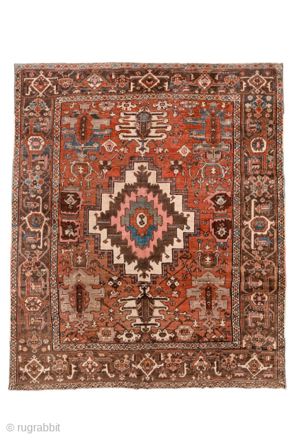 Antique Persian Serapi Carpet, circa 1900. Featuring a bold geometric medallion on a warm rust field with soft blue and ivory accents, framed by a classic Heriz-style border. Strong Northwest Persian design  ...