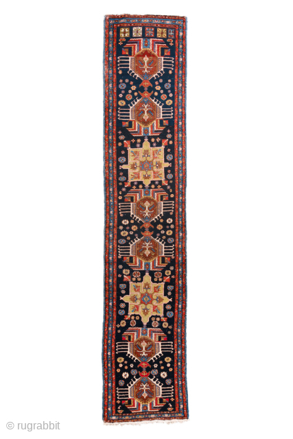 Antique Persian Heriz Runner, circa 1910. Featuring a column of bold geometric medallions on a deep indigo field with ivory and red accents, framed by a classic Heriz border. Strong Northwest Persian  ...