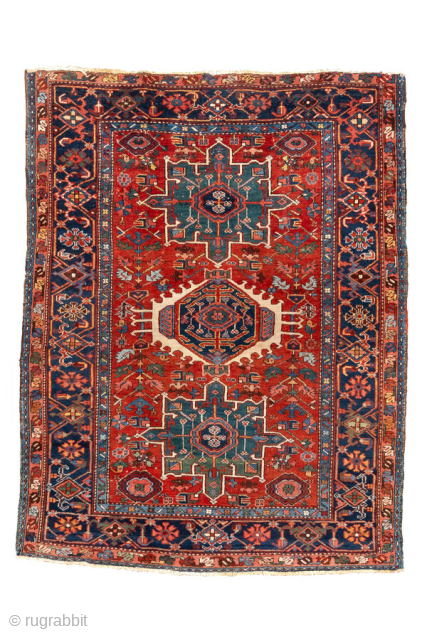 Antique Persian Karaje Rug, circa 1910. Featuring bold geometric medallions on a rich red field with deep blue and ivory accents, framed by a lively tribal border with strong Northwest Persian character.
Item ...