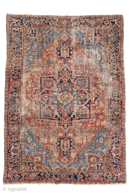 Antique Persian Heriz Rug, circa 1900. Featuring a bold geometric medallion on a richly abrashed field of soft red, ivory, and sky-blue tones, framed by a classic navy Heriz border. Wonderfully timeworn ...