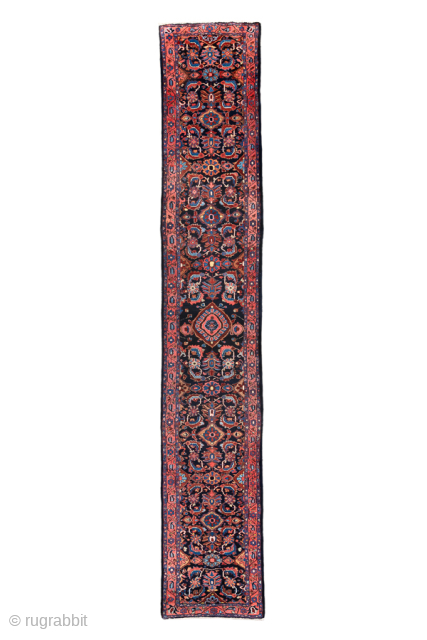 Antique Persian Lilian Runner, circa 1920. Featuring an elegant allover floral design on a deep navy field with rich rose, ivory, and sky-blue accents, framed by a finely detailed border. Long and  ...