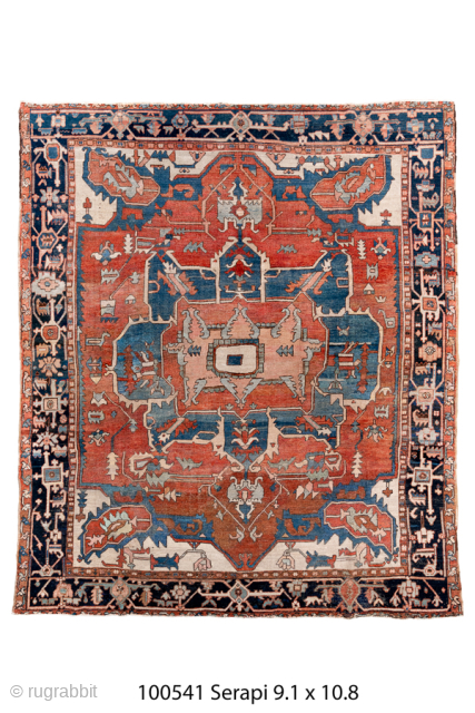 Antique Persian Serapi Carpet, Circa 1900. Features a dramatic stepped medallion set within a vibrant coral-red field framed by a richly detailed navy border.

9'1" x 10'8"

Item No: 100541     