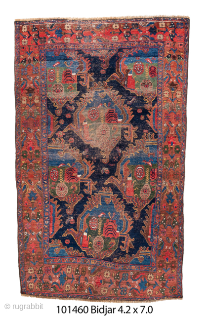 Antique Persian Bidjar Rug, Circa 1900. Dramatic series of geometric medallions across a deep indigo field framed by a richly detailed coral-red border. Saturated natural dyes, distinctive composition, and substantial character.

4'2" x  ...