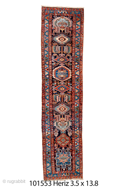 Antique Persian Heriz Runner, Circa 1910. Features a vibrant series of geometric medallions woven in rich shades of navy, terracotta, sky blue, and ivory. Bold drawing, durable construction, and tribal character.

3'5" x  ...