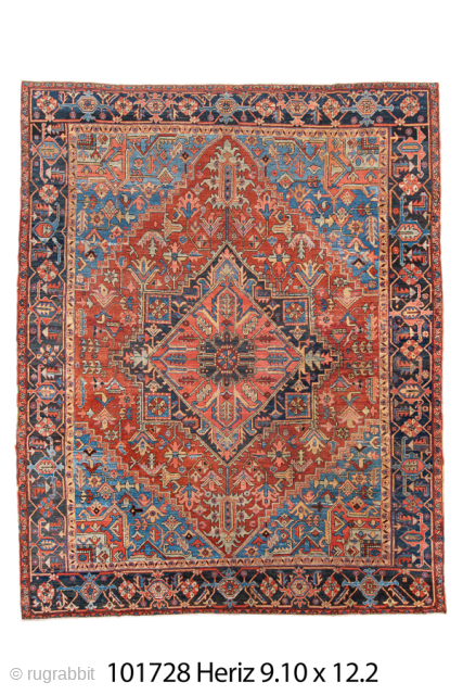 Antique Persian Heriz Rug, Circa 1900. Dramatic geometric medallion design woven in rich shades of brick red, navy blue, sky blue, and ivory. Impressive scale and vibrant palette create a powerful focal  ...