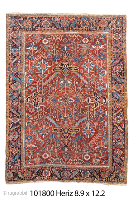 Antique Persian Heriz Rug, Circa 1910. Elaborate geometric floral design woven in rich terracotta, navy, ivory, and soft blue tones. Strong drawing, durable construction, and vibrant character. 

8'9" x 12'2"

Item No: 101800 