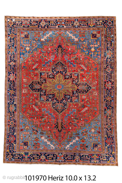 Antique Persian Heriz Rug, Circa 1910. Features a bold geometric medallion design rendered in vibrant shades of red, navy, sky blue, and camel. Commanding scale, rich colors, and durable construction make ...