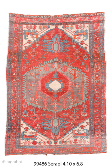 Antique Persian Serapi Rug, Circa 1900. Bold geometric medallion woven across a vibrant coral-red field with soft blue-gray accents and ivory corner spandrels. 

4'10" x 6'8"

Item No: 99486     
