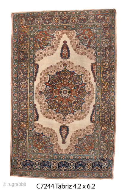 Antique Persian Tabriz Rug, Circa 1920. Beautifully detailed medallion design surrounded by elegant floral and arabesque motifs on a luminous ivory field. Sophisticated palette and balanced composition make it a versatile addition  ...