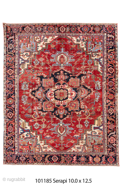 Antique Persian Serapi Carpet, Circa 1900. Bold crimson stepped medallion surrounded by ivory and sky-blue geometric motifs, framed by a richly detailed midnight-blue border.

10'0" x 12'5"

Item No: 101185     
